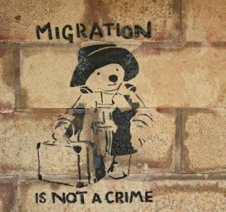 Banksy-style mural about migration not being a crime
